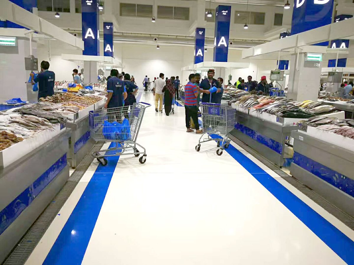 Modern fish market hall interior with high humidity and bright uniform overhead lighting