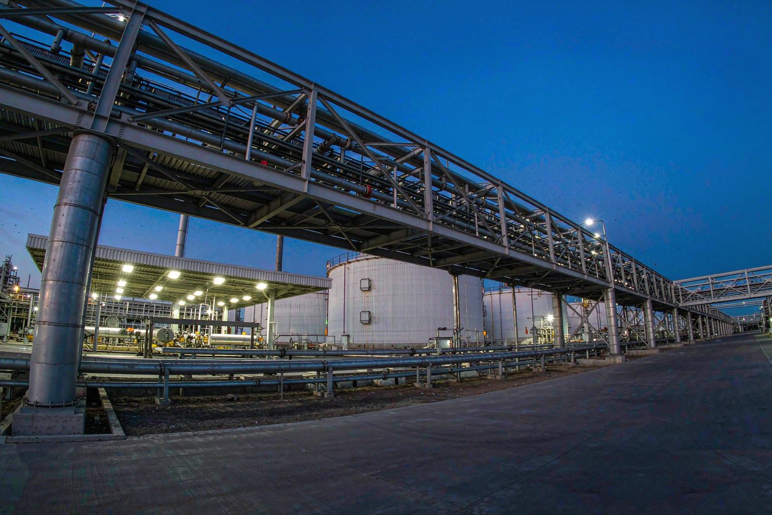 Tank farm at dusk panorama lit by explosion-protected LED luminaires in Australia